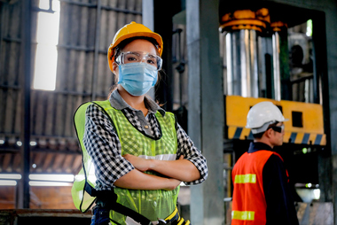woman warehouse worker wearing safety mask, hat, and glasses | EEOC Covid-19 Updates | Dalby, Wendland & Co. | CPAs & Business Advisors | Grand Junction CO | Glenwood Springs CO | Montrose CO 