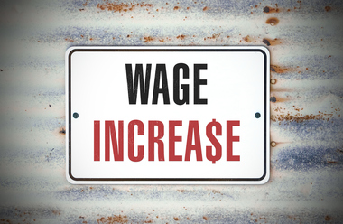 words wage increase with dollar sign replacing letter S against bokrah background