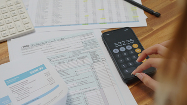 Using calculator to fill out tax paperwork